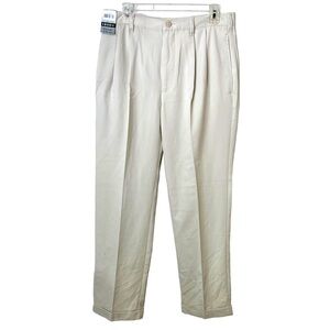 NEW IZOD MENS SLACKS SIZE 32X32 A POLY. BLEND W/CUFFS AND PLEATS.